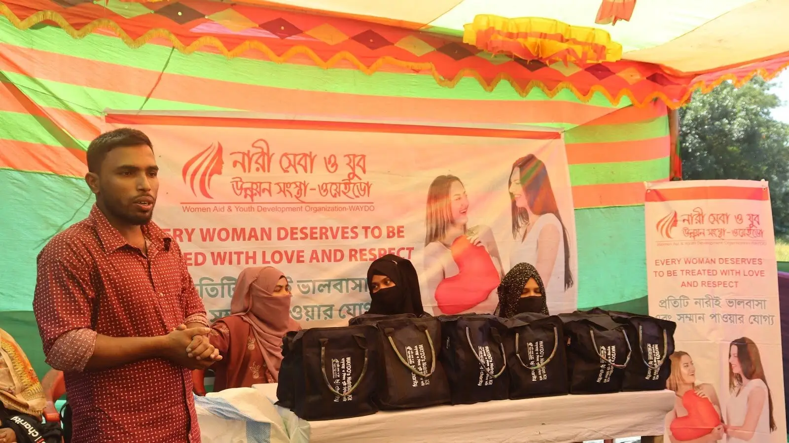 WAYDO awareness session with women in a community tent